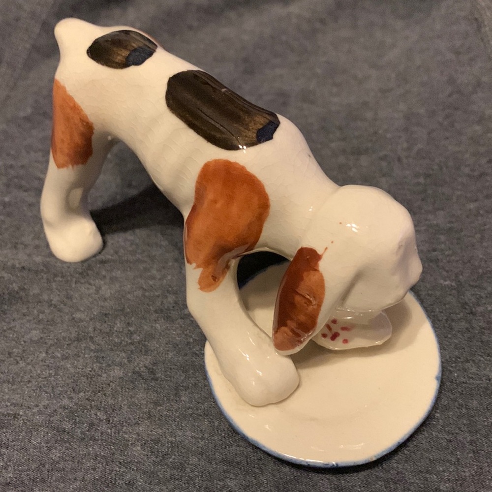 Vintage hound dog eating from a bowl figurine